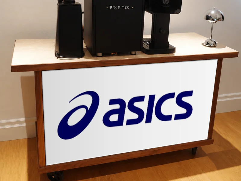 Custom bar signage example with the ASICS logo on the walnut coffee cart